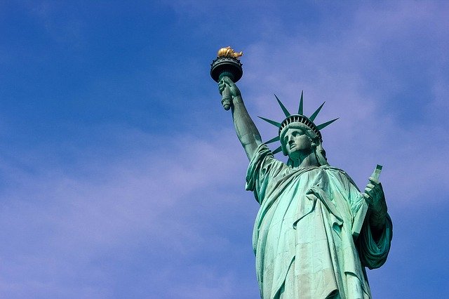 The statue of liberty against a blue sky